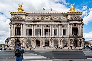 Parisians relaxing on the steps of the Opera Garnier house - Paris, France