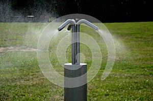 Park air freshener with micro drip sprayer made of stainless steel in a public park in the hot summer will relieve runners who wil