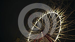 Park attraction ferris wheel carousel swing Night evening with illuminated light