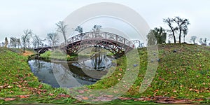 Park at autumn with dark sky, river and bridge Ugly landscape. 3D spherical panorama with 360 degree viewing angle Ready for virtu photo