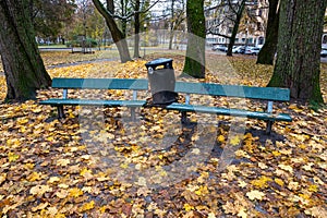 Park bench in a autumn colored city of Orebro Sweden