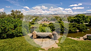 Park bench and the distant skyline of Boise Idaho