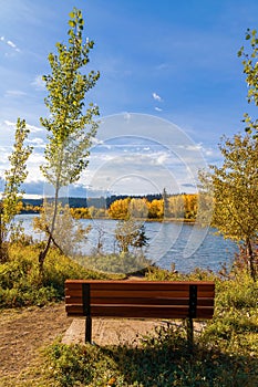 Park Bench Overlooking A Fall River Valley