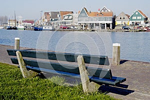 Park bench overlooking Volendam Harbour, Holland photo