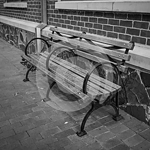 Park Bench on Sidewalk in Addison