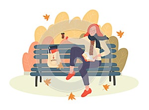 Fall. Woman reading books in the autumn park. photo