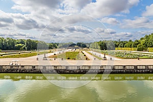 The park and the decorative fence of channel in the estate of Vaux-le-Vicomte, France photo