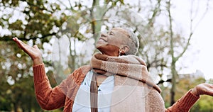 Park, freedom and happy senior black woman relax in nature, forest and woods with hands for rain. Retirement, natural