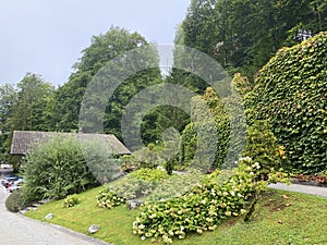 A park with a garden and green areas next to the Grand Hotel Giessbach above Lake Brienz Brienzersee - Canton of Bern