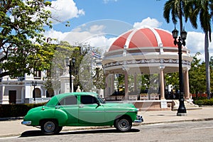 Park Jose Marti in Cienfuegos with vintage car, Cuba