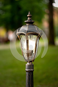 park lantern lights, lamp post in green public space