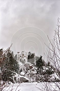 Park Mon Repos in a snowy forest in Vyborg in winter