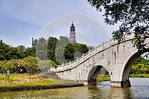Park with pagoda and bridge over the lake. Mountain Shunfengshan Park, Foshan City, China