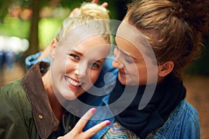 Park, peace sign and portrait of women hug on holiday, vacation and weekend in nature. Happy, smile and face of people