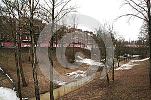 Park and ravine in Kronstadt, Russia in winter cloudy day