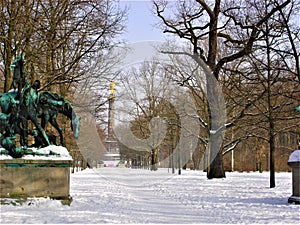 Park, sculpture, bare trees, snow, winter and sky photo