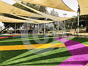 Park with set of modern kids playground background in Gan Be Ivrit, Rishon Le Zion