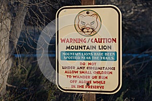 Park sign warning hikers about mountain lions