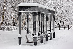 Park swing during snowstorm at winter in Moscow, Russia. Scenic view of a snowy city street. Moscow snowfall background