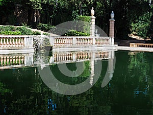 Park with trees and an old pond.