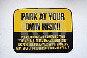 Park at your own risk sign