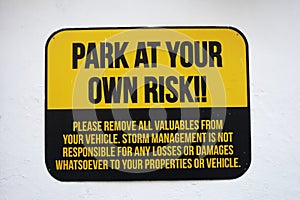 Park at your own risk sign