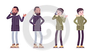 Parka man and woman standing with phone