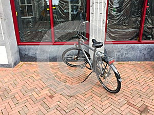 Parked bike on a footpath. The Netherlands