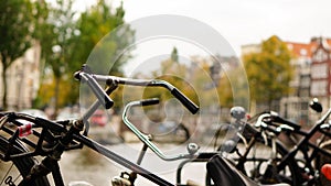 Parked bikes alongside a canal in Amsterdam