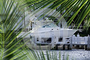 parked boat at dock on canal in Florida, USA