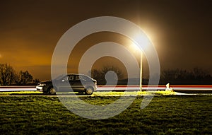 Parked car at night photo