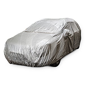 Parked car with protective gray rain cover on a white backgraund