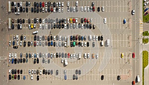 Parked cars in the Parking lot near the shopping center. Aerial view