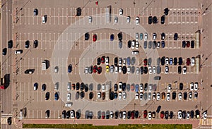 Parked cars in the Parking lot near the shopping center. Aerial view