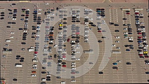 Parked cars in the Parking lot near the shopping center. Aerial view