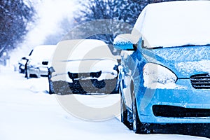 Parked Cars on a Snowstorm Winter Day