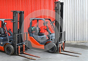 Parked Forklifts in warehouse front
