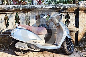 Parked gray scooter. The capital of GOA - Panaji