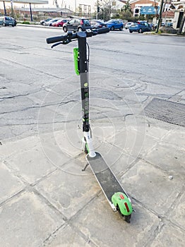 Parked Lime electric Scooter rental without passenger.