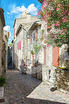 Parked motor in a street of the village Viviers in the Ardeche