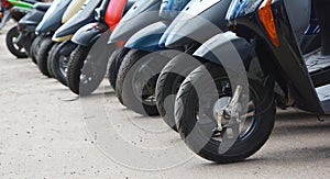 Parked motorbikes on the city street photo