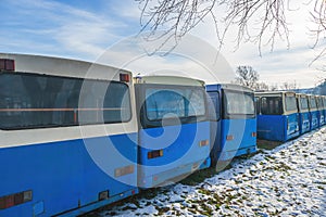 Parked obsolete public transportation bus vehicles in winter