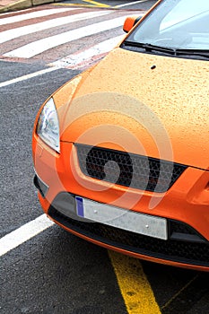 Parked orange sports car