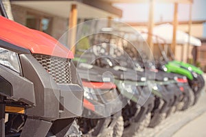 Parked in a row several atv quad bikes extreme outdoor adventure concept