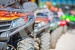 Parked in a row several atv quad bikes extreme outdoor adventure concept