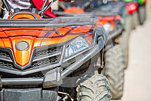 Parked in a row several atv quad bikes extreme outdoor adventure concept