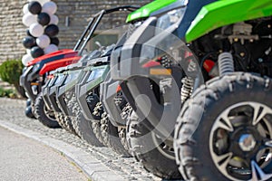 Parked in a row several atv quad bikes extreme outdoor adventure concept