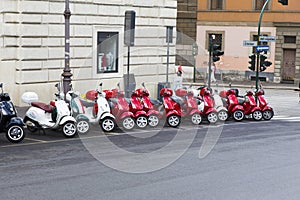 Parked scooters in front of a rental shop