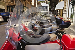 Parked scooters on italian city street