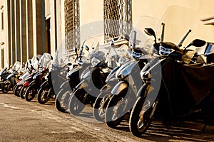 Parked scooters in an Italian old town.